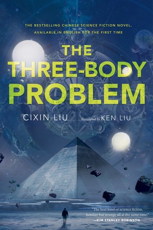 A blue book with the title THE THREE-BODY PROBLEM in bold capitalized semi transparent yellow text. There is a large pyramid in the center of an illustration and a small figure walking towards it.